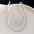 Double-layered butterfly flower necklace featuring silver beads and white pearls - Pearl Crushed Silver Double Layer Necklace