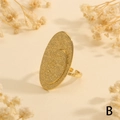 Detailed view of adjustable gold-plated hammered texture oval ring on warm background - Oval Face Hammered (RG1059-B)