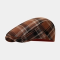 Side view detail of retro Scottish plaid newsboy cap with brown and orange textures - One Size / Dark Brown