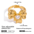 Detailed view of gold bow ring with heart-shaped zircon and adjustable stainless steel band - Heart Zirconia Bow Adjustable Ring (JDR0207007)
