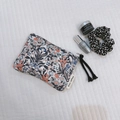 Floral cotton pouch with blue flowers, white zipper and long black fringe tassel detail - Vintage Black Red