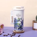White stainless steel coffee mug with purple floral print and portable coffee strap - Iris