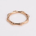 Macro shot of rose gold minimalist bamboo design ring with polished metal texture - US 5 / Rose Gold