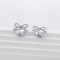 Polished silver stainless steel bow and heart pendant stud earrings on white pedestal - Silver Bowknot Heart Style (KLD3391)