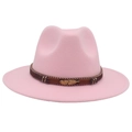 Detail of pink fedora hat featuring a brown leather band and golden feather ornament - Pink