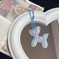 Macro shot of iridescent balloon dog keychain with pearlescent finish and blue bead chain - Laser Blue