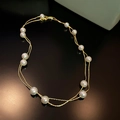 Detailed view of elegant double-layered gold necklace with lustrous white pearls - Gold Double Layer Pearl Style (13# Necklace)