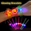 Kids LED glowing wristbands set featuring colorful cartoon patterns on black background - Cartoon LED Wristband