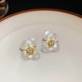 Macro shot of gold-plated flower earrings with pearl finish petals and zircon center - White Flower (Gold Plated 925 Silver Needle)