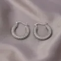 Silver hoop earrings with pave-set clear zircon stones on grey silk fabric background - Silver Full Diamond Hoop / E-101---Platinum