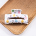 White Easter hair claw clip with colorful egg and bunny patterns in glossy finish - White Easter Egg