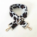 Macro shot of thick leopard print jacquard bag strap with golden metal swivel hooks - Silver & Coffee