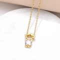 Exquisite gold-plated necklace with a cute zircon-encrusted human pendant on marble background - Girl Style / 18K Gold / White