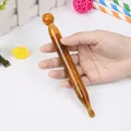 Amber-toned resin acupoint massage pen with dual-head design for facial lifting - Acupuncture Pen / Amber