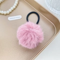 Pink plush faux fur ball hair tie with high elastic band on a golden display tray - Berry Red