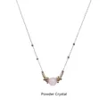 Macro detail of powder crystal pendant with golden beads on a stainless steel chain - Rose Quartz-Gold Chain