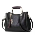 Chic black PU leather handbag with metal cat tassel and adjustable shoulder strap - Black