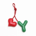 Detailed close-up of handmade red heart and green leather letter Y charms with stitching - Green with Bright Red Heart