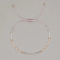 Pink adjustable string bracelet with white, grey, and soft pink cylindrical beads - Pink Rope Pink Grey White Gold Beads (MI-B230001C)