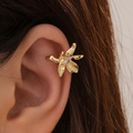 Elegant gold-plated flower ear cuff with sparkling zircon stone on hair background - Gold Flower Zirconia Ear Cuff