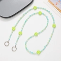 Detail of green and blue beaded phone lanyard with acrylic flowers and metal ring clasps - Green