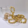 Golden bead necklace with mirror finish on transparent cup for party celebrations - Gold Toy Bead Chain Cup