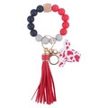 Silicone bead wristlet keychain with red and black beads, cow print charm and tassel - Red