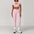 Pink yoga set featuring a short-sleeve cutout top and high-waist cross-waistband leggings - S / Top And Bottom / Short Sleeve + Leggings / Peach Pink