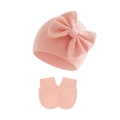 Detail of pink knitted baby hat with bow and matching mittens set for newborns - Shrimp Pink