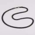 Macro shot of durable black stainless steel box chain necklace with lobster clasp detail - Black
