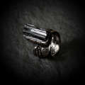 Macro shot of raw black tourmaline stone on a vintage bronze feather-shaped ring band - Black Tourmaline (Random Shape)