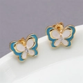Detail of gold butterfly stud earrings with blue and white enamel and a tiny clear crystal - Lake Blue