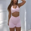 Pink halter sports bra and high-waist shorts set for women in a two-piece athletic yoga outfit - XS / Pink