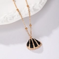 Elegant gold bead chain necklace with a black shell pendant and gold-plated borders - Black & Gold Scallop