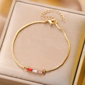 Gold box chain bracelet featuring ruby red, clear, and pink rectangular gemstones - Gold Tricolor Rectangle Gemstone Bracelet (12173)