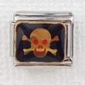Detail of Italian modular charm with golden skull crossbones and red enamel eyes - Gold Skull