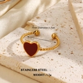 Golden stainless steel twisted ring featuring a red heart pendant with 1.7cm diameter - Twisted Weave Heart Pendant Style (1307)