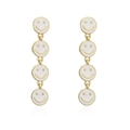 Golden long drop earrings featuring white enamel smiley faces in a minimalist style - White