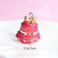 Macro view of 2.3x2.5cm red resin Christmas bell charm with gold bow and glitter - Style 39-Red Bell with Bow