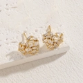 Golden heart stud earrings with channel-set baguette cubic zirconia on stone base - Heart Zirconia