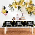 Detail of black and gold Happy Birthday tablecloth with festive balloon and cake patterns - Black Gold Happy Birthday