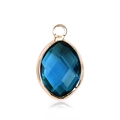 Detailed close-up of a sapphire blue marquise glass pendant with rose gold plated casing - Gold - December