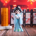 Detail of a cute Chibi girl figurine in blue Hanfu holding a white cat with floral hair decor - Large Holding Cat Style (1218-1C)