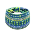 Close-up of bohemian wide headband featuring vibrant blue and green geometric ethnic patterns - Style 5