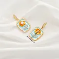 Blue enamel sunflower pendant with natural pearl and gold plating in 17.6mm width - Style 6 Blue Base Sunflower Rectangular Pendant