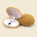 Elegant shell-shaped flocked jewelry box in yellow with soft white interior lining - Apricot