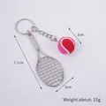 Mini pink tennis ball keychain with silver metal racket showing 7.7cm size and 15g weight - 2cm Small (Red + Rose Red) Dual-tone Tennis Ball + Silver Racket
