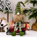 Christmas gnome doll with green knit hat and striped legs on red vintage car - Striped Hanging Leg Gnome / Green