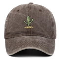 Close-up of vintage washed brown baseball cap featuring green cactus embroidery detail - Coffee