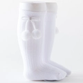 White ribbed knee-high baby socks featuring cute pom-pom bow accents on the side - Bleached White